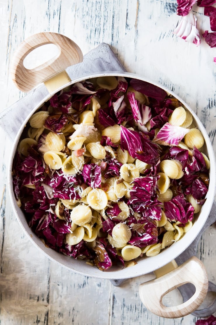 orecchiette pasta in a large pan with radicchio and pancetta