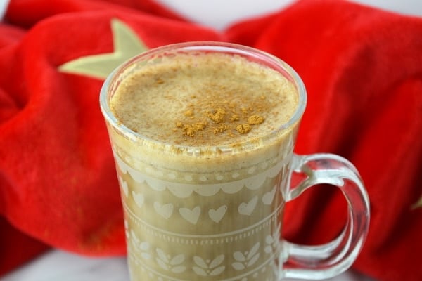 Close up of banana milk coffee topped with cinnamon