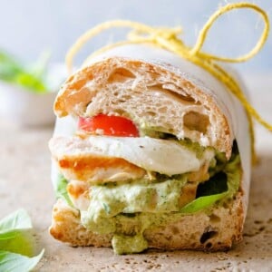 A close up of a chicken pesto ciabatta