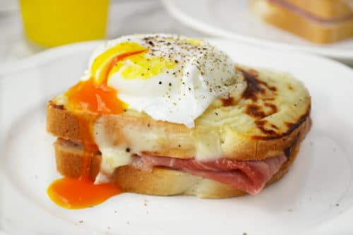 Croque Madame - mustard and ham toasts topped with a cheesy bechamel sauce and a perfectly cooked poached egg. Breakfast heaven.