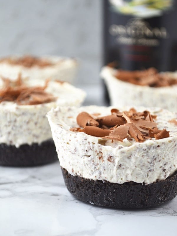 These Boozy Baileys Mini Cheesecakes are so easy to make and are the perfect festive party food, they'll be gone in no time! www.insidetherustickitchen.com