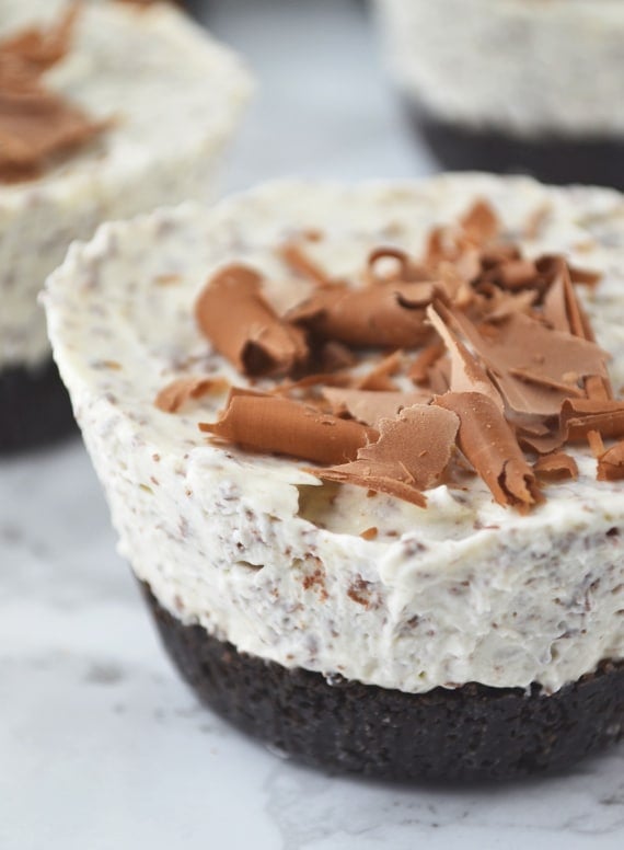 A close up of baileys mini cheesecakes topped with chocolate