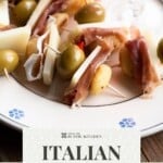 A Pinterest graphic for Italian antipasti skewers.