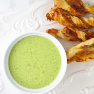 You will love this Sour Cream Pesto Dip with Prosciutto Dippers Recipe. Homemade pesto is swirled with sour cream and served with mustard, Parmesan and Prosciutto pastry twists. www.insidetherustickitchen.com
