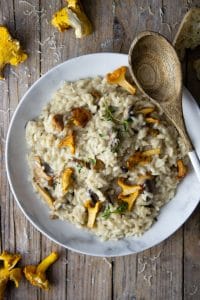 An overhead shot of creamy mushroom risotto with chanterelle mushrooms