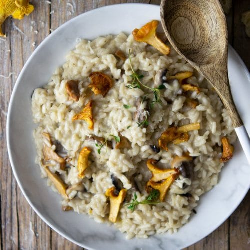 An overhead shot of creamy mushroom risotto with chanterelle mushrooms