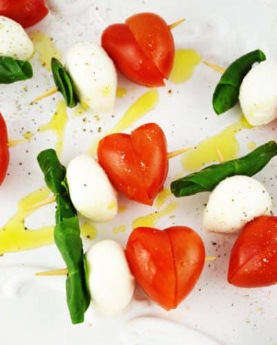 These fun Valentine's Caprese Skewers are a perfect fuss free appetizer using classic Italian ingredients you can't go wrong! www.insidetherustickitchen.com