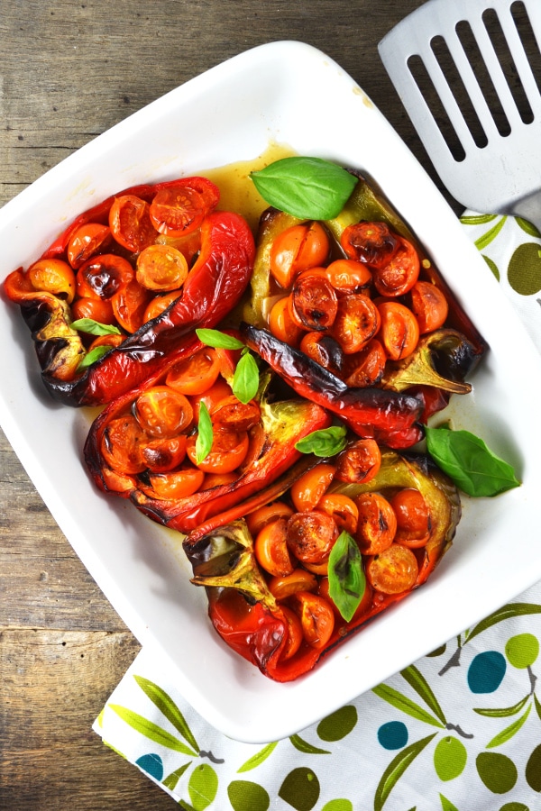 These delicious Italian stuffed peppers are stuffed with anchovies, garlic, basil and cherry tomatoes. A super easy and speedy lunch or dinner that you'll love! www.insidetherustickitchen.com