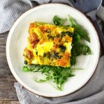 This Artichoke and Spinach Frittata is perfect for a light lunch this Spring with peas, leek and goats cheese it is packed full of flavour! www.insidetherustickitchen.com