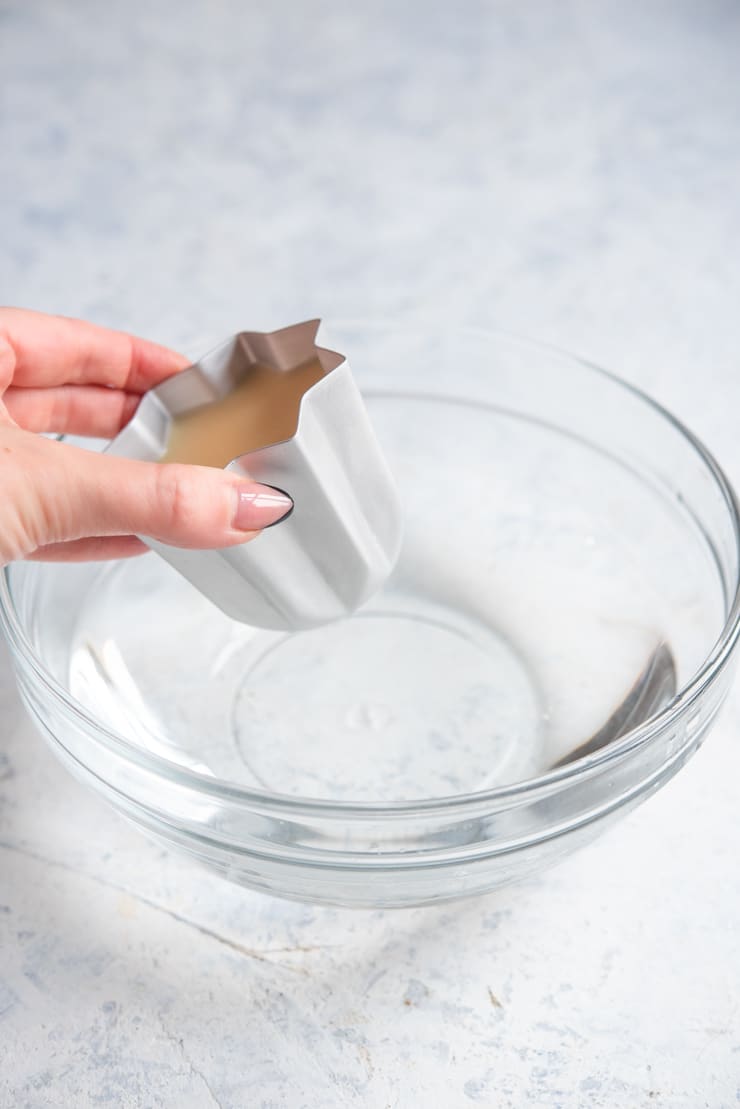 A photo showing how to remove panna cotta from moulds