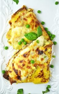 These Crespelle (savoury crepes) are stuffed with ricotta, peas and ham and baked with a delicious Fontina cheese sauce! www.insidetherustickitchen.com