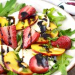 Roasted strawberries, sweet peaches, and delicious mozzarella cheese are sprinkled with mint, toasted pine nuts, and balsamic glaze. It's fresh, light and perfect for summer. insidetherustickitchen.com