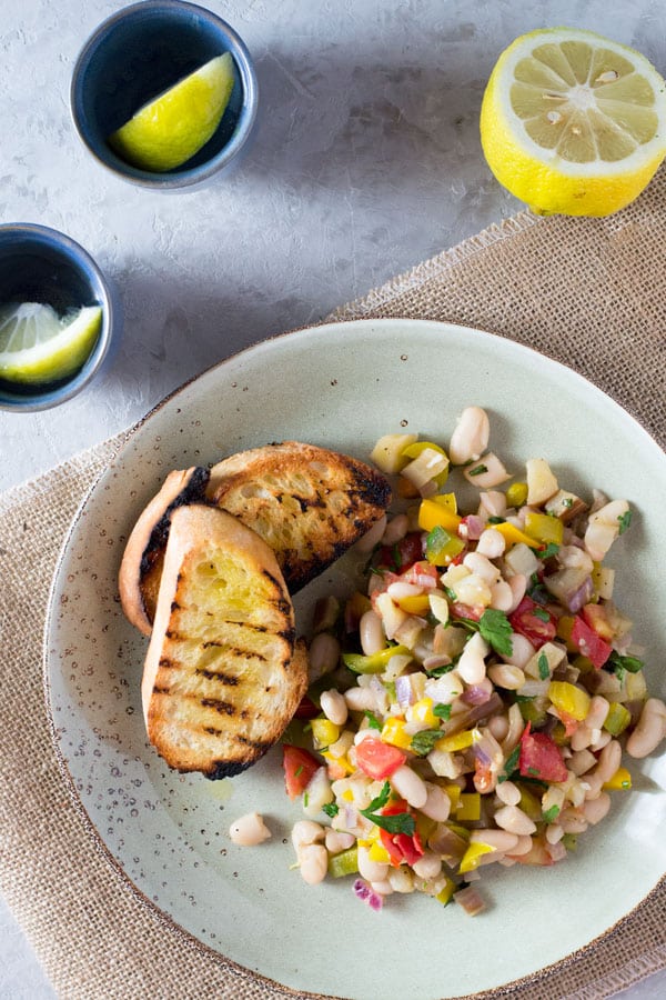 Warm easy bean salad with eggplant, tomato, garlic and fresh herbs. Insidetherustickitchen.com