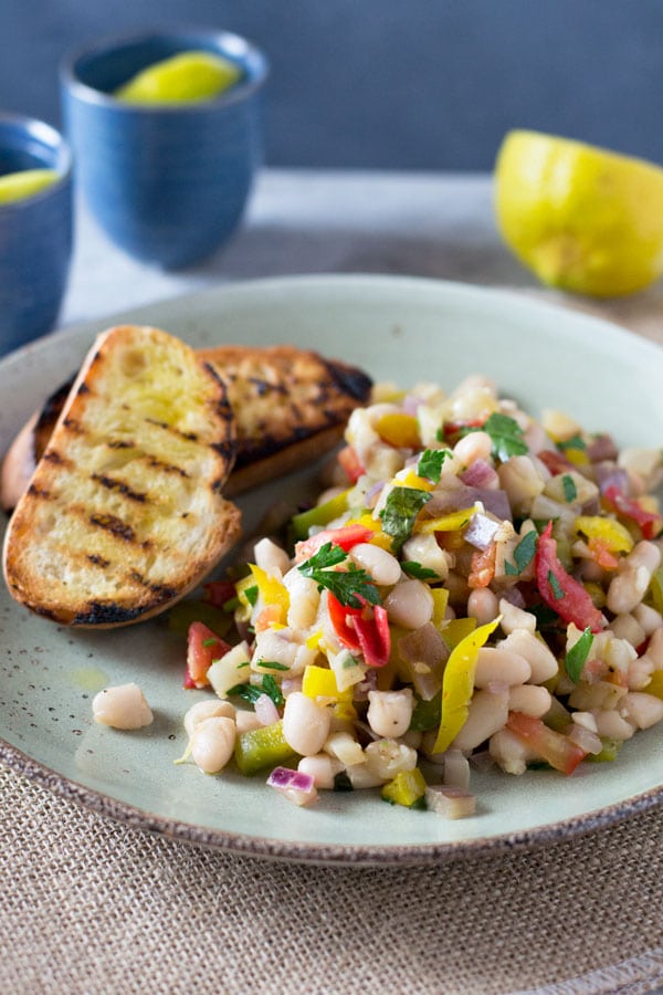 Warm easy bean salad with eggplant, tomato, garlic and fresh herbs. Insidetherustickitchen.com