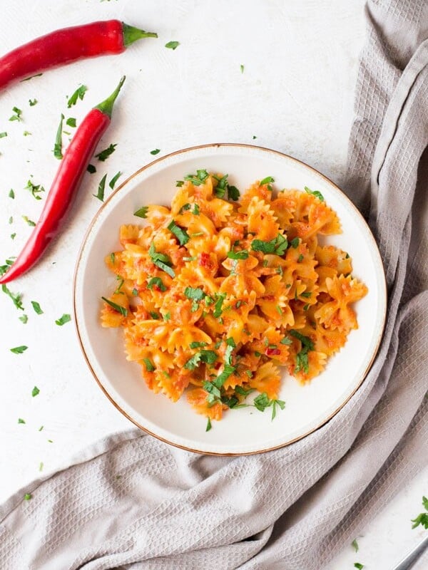 A delicious and simple farfalle pasta with pancetta recipe with fresh chili, garlic and a dash of cream. This simple pasta dish makes a great quick weeknight meal that's delicious eaten hot or cold. Italian pasta recipes inside the rustic kitchen