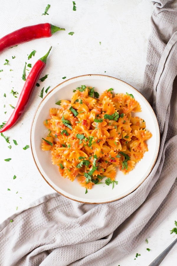 A delicious and simple farfalle pasta with pancetta recipe with fresh chili, garlic and a dash of cream. This simple pasta dish makes a great quick weeknight meal that's delicious eaten hot or cold. Italian pasta recipes inside the rustic kitchen