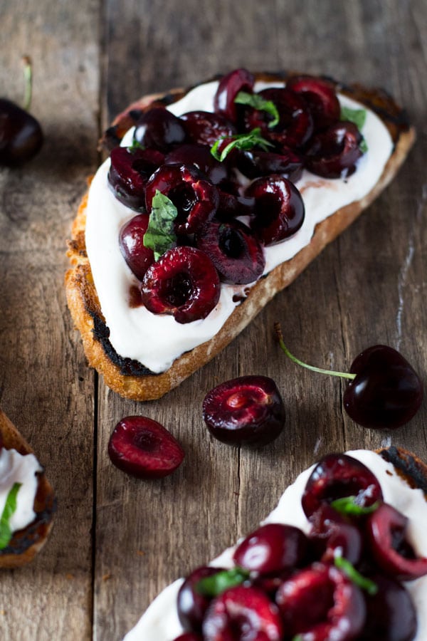 Whipped ricotta toast with balsamic cherries inside the rustic kitchen