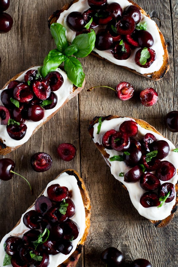 Whipped ricotta toast with balsamic cherries inside the rustic kitchen