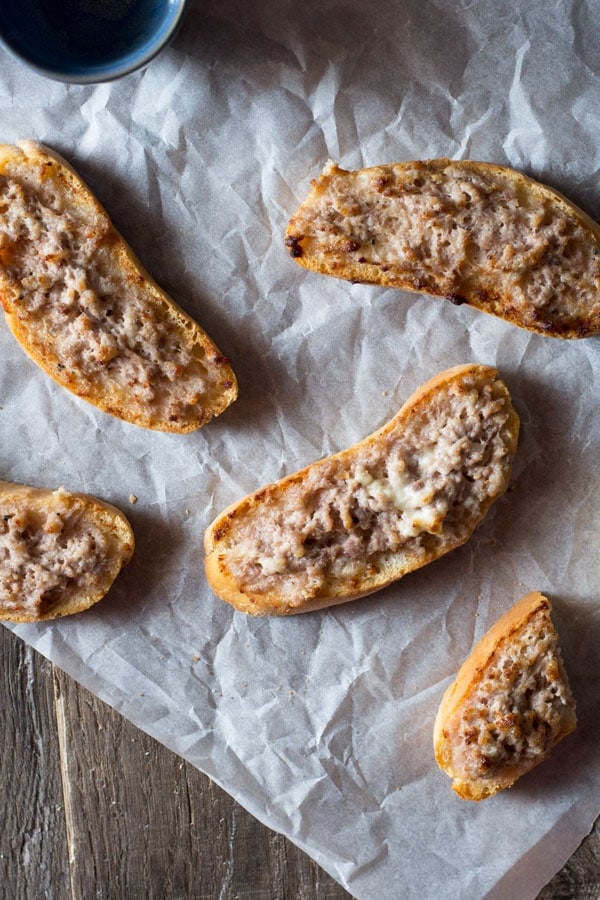 stracchino and sausage crostini inside the rustic kitchen