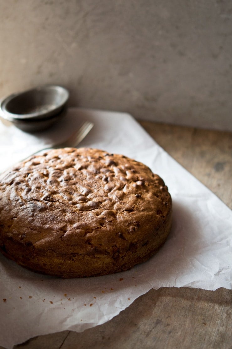 Traditional and authentic Italian apple olive oil cake inside the rustic kitchen