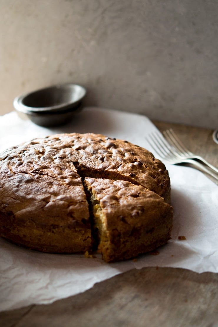 Traditional and authentic Italian apple olive oil cake inside the rustic kitchen