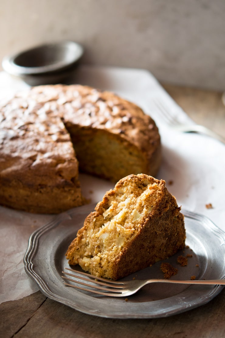 Traditional and authentic Italian apple olive oil cake inside the rustic kitchen