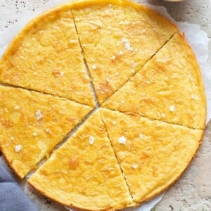 A close up of la farinata flatbread on a stone worktop