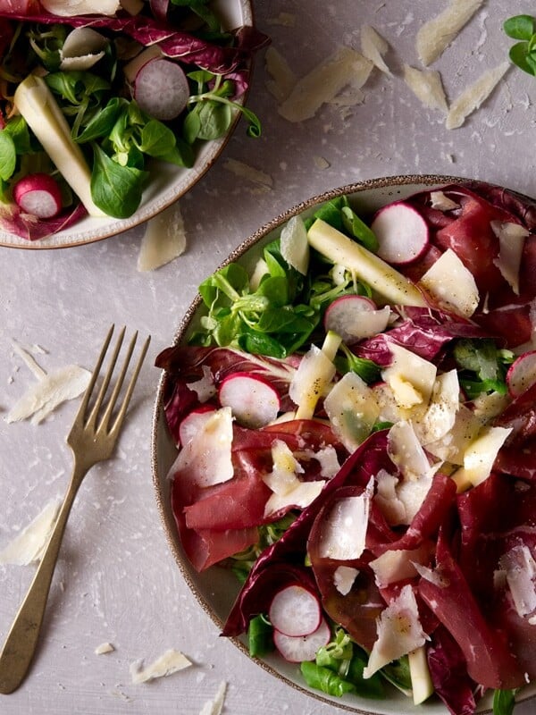 Bresaola salad with apple and radicchio. An easy Italian salad recipe with parmesan, radishes and a simple garlic, olive oil dressing. A great light lunch or starter that's packed full of delicious flavours. More authentic Italian recipes at Inside the rustic kitchen.
