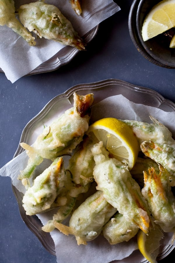 Crispy fried zucchini flowers stuffed with ricotta, chili flakes and lemon Inside the rustic kitchen