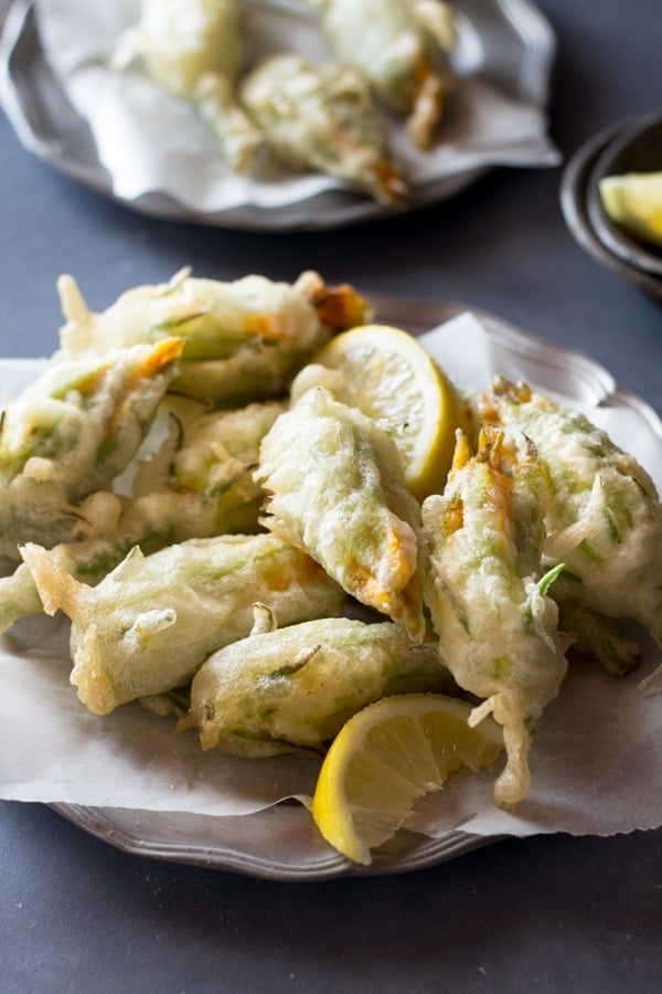 Crispy fried zucchini flowers stuffed with ricotta, chili flakes and lemon Inside the rustic kitchen