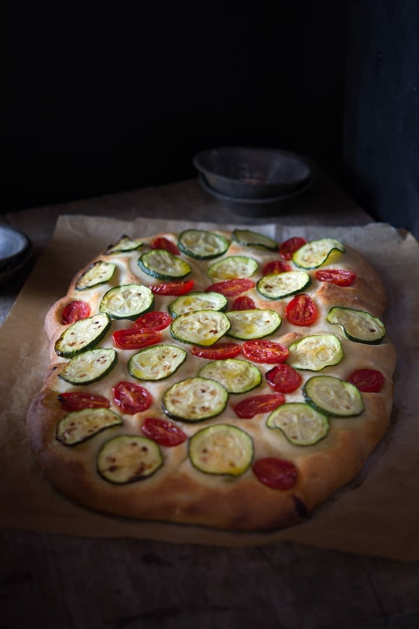 zucchini tomato focaccia inside the rustic kitchen