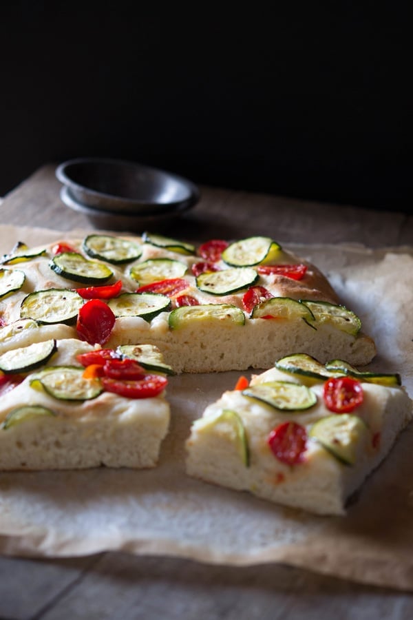 zucchini tomato focaccia inside the rustic kitchen