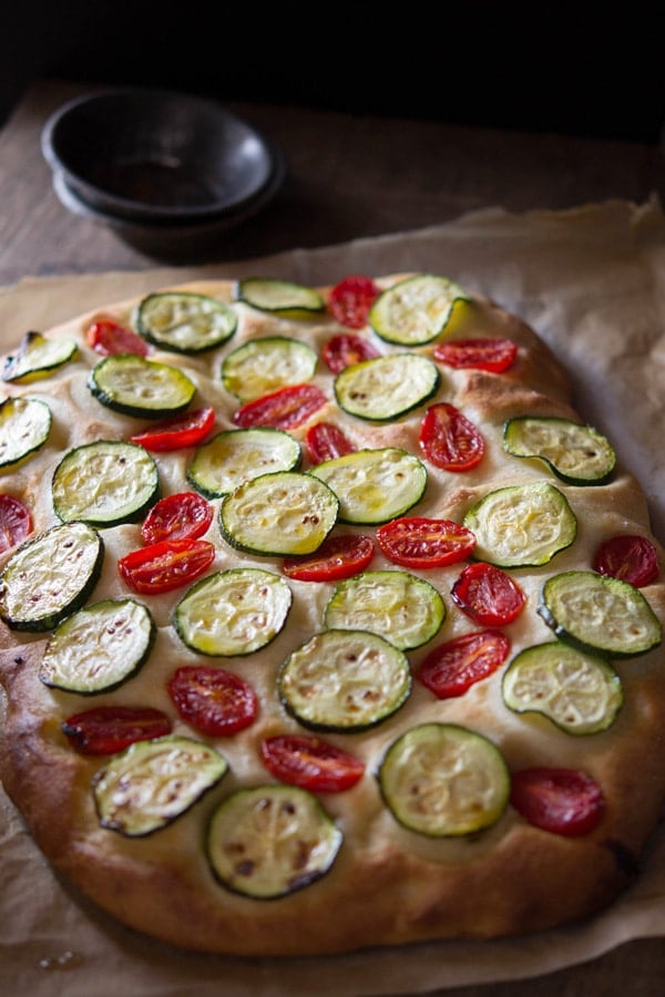 zucchini tomato focaccia inside the rustic kitchen