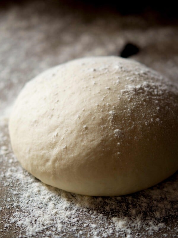 A close up of a ball of pizza dough