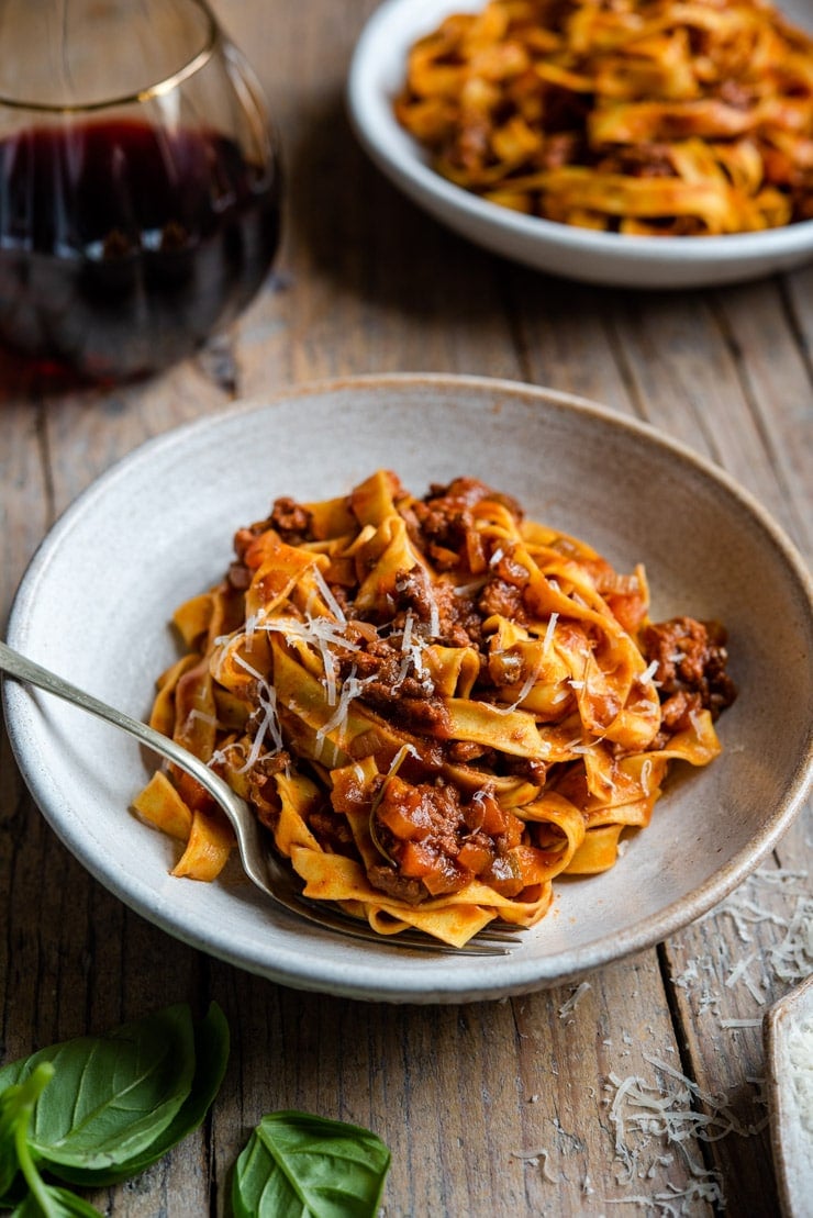 Italian beef ragu tossed with tagliatelle pasta in a bowl