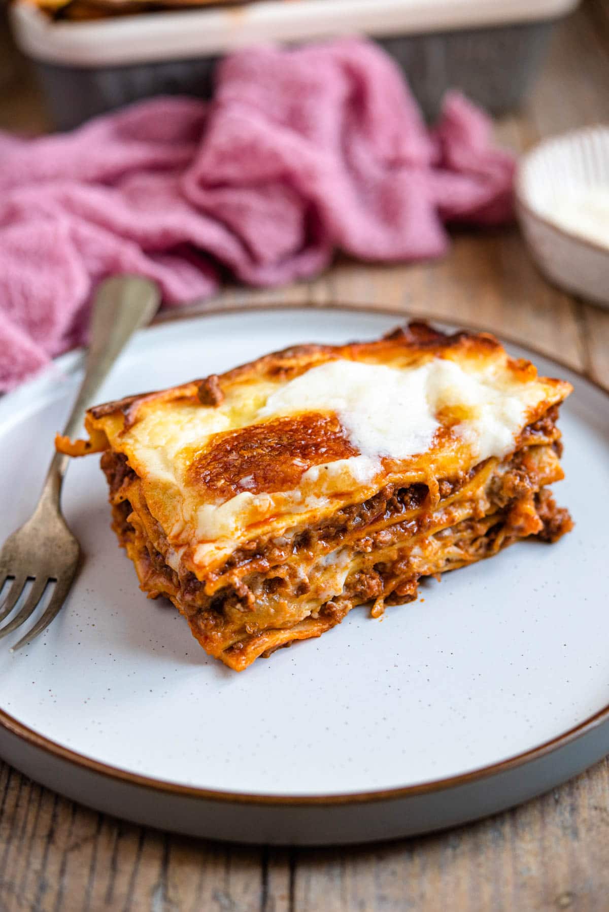 A slice of beef lasagna on a plate