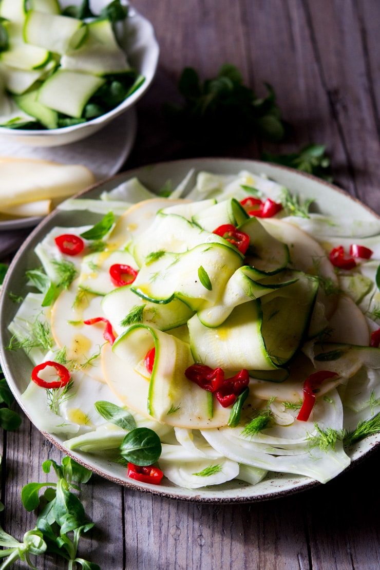 A large plate of courgette salad with fennel and smoked scamorza cheese
