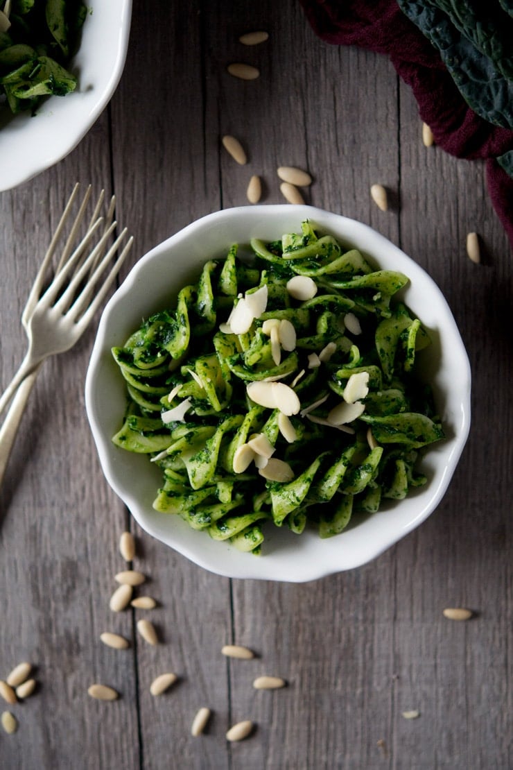 Pesto pasta sauce made with cavolo nero in a white bowl on a wooden surface