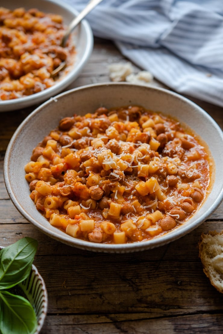 Pasta fagioli soup in a rustic bowl with crusty bread