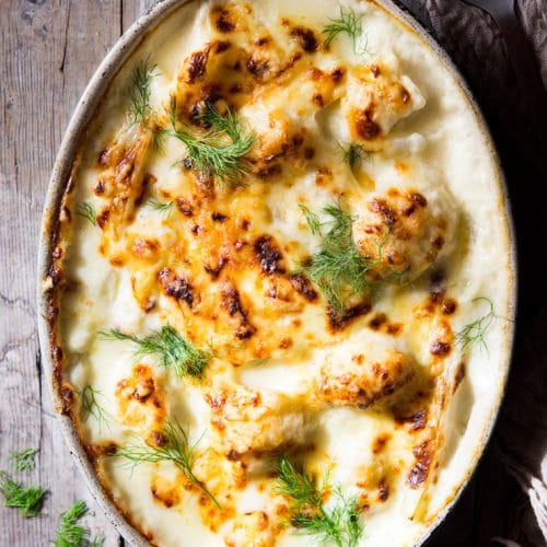 baked cauliflower cheese in a oval baking dish
