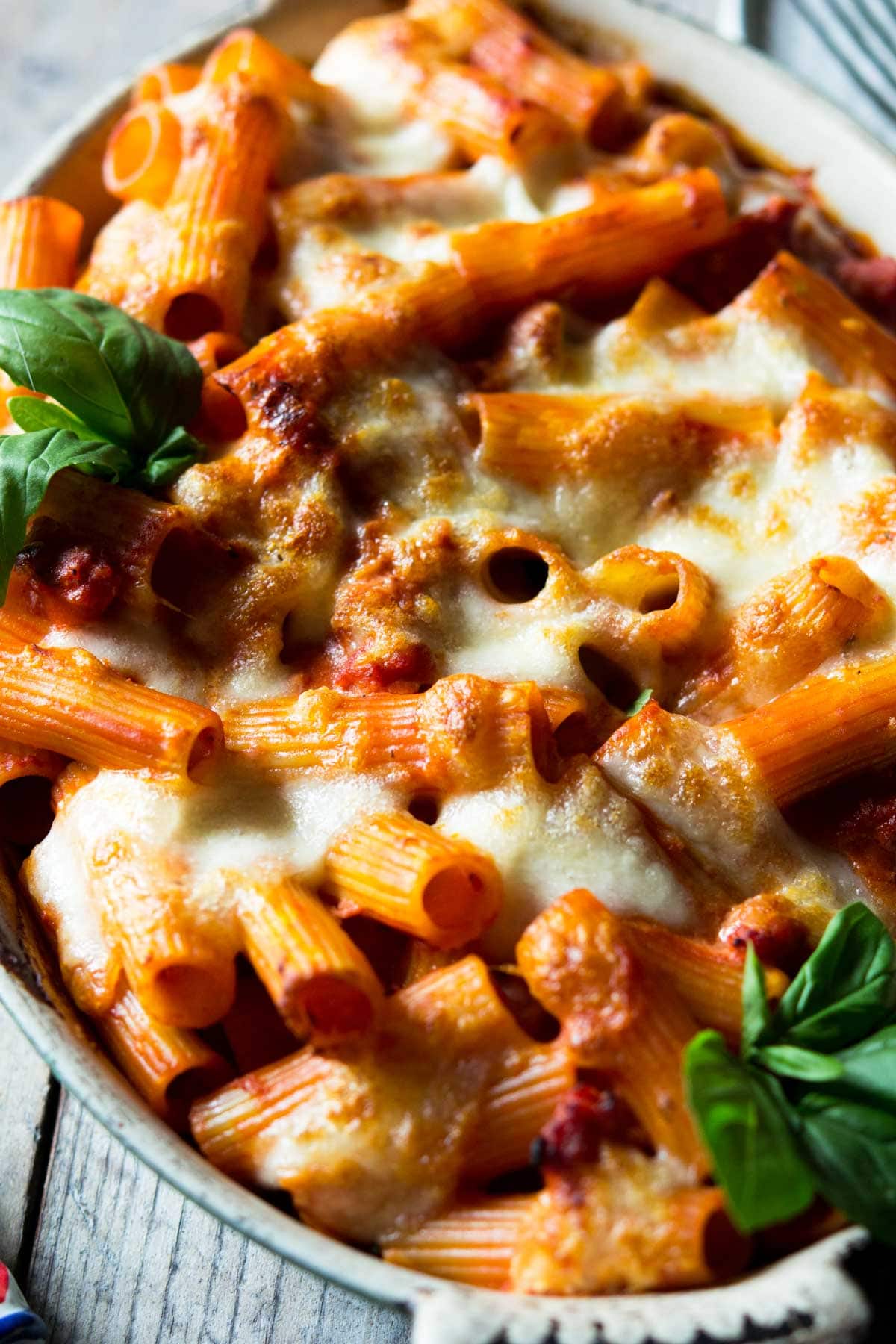 A close up of cheesy baked pasta