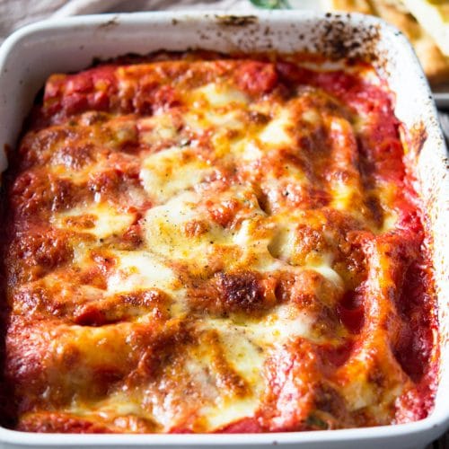 spinach and ricotta cannelloni in a large baking dish