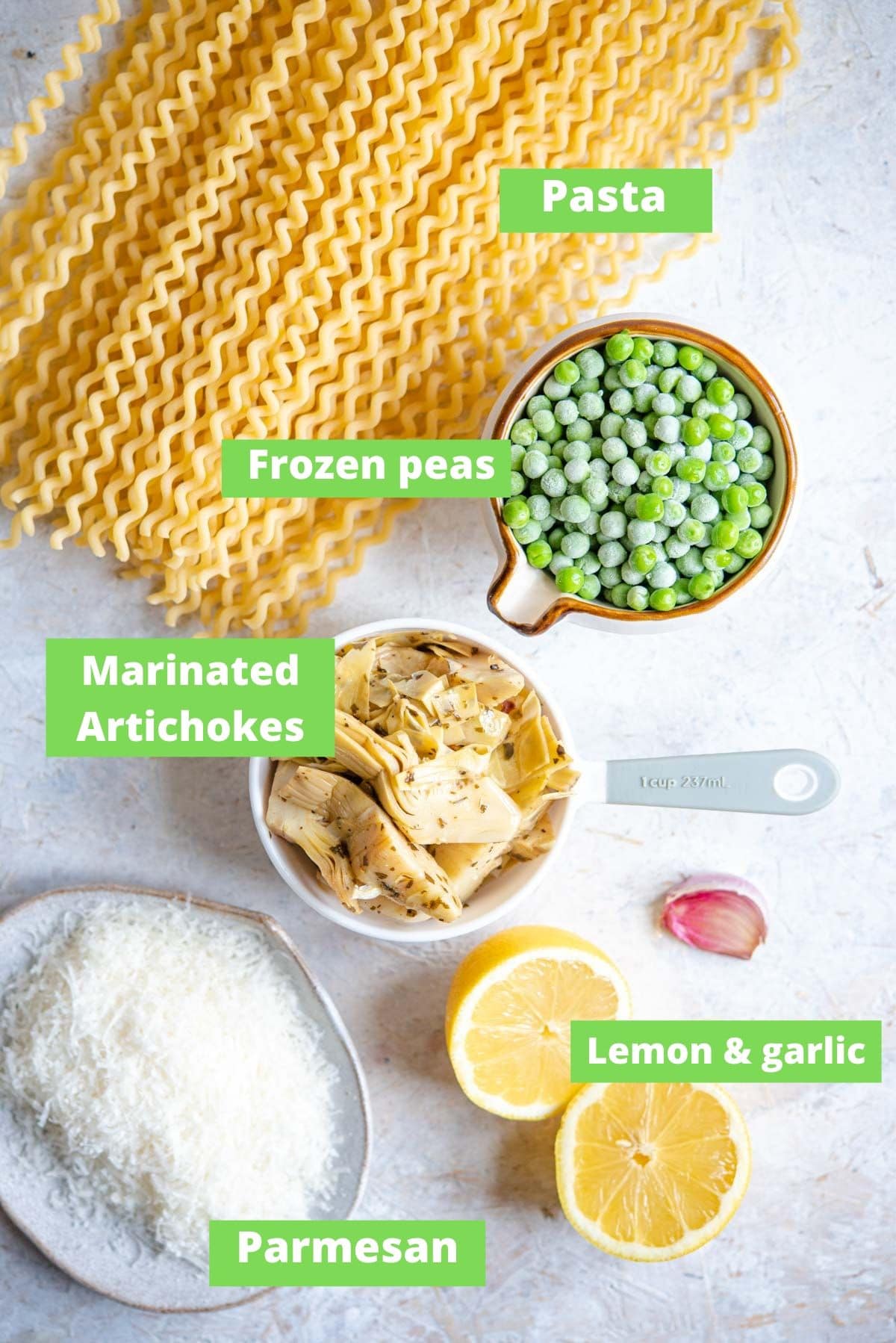 An overhead shot of ingredients for making artichoke pasta