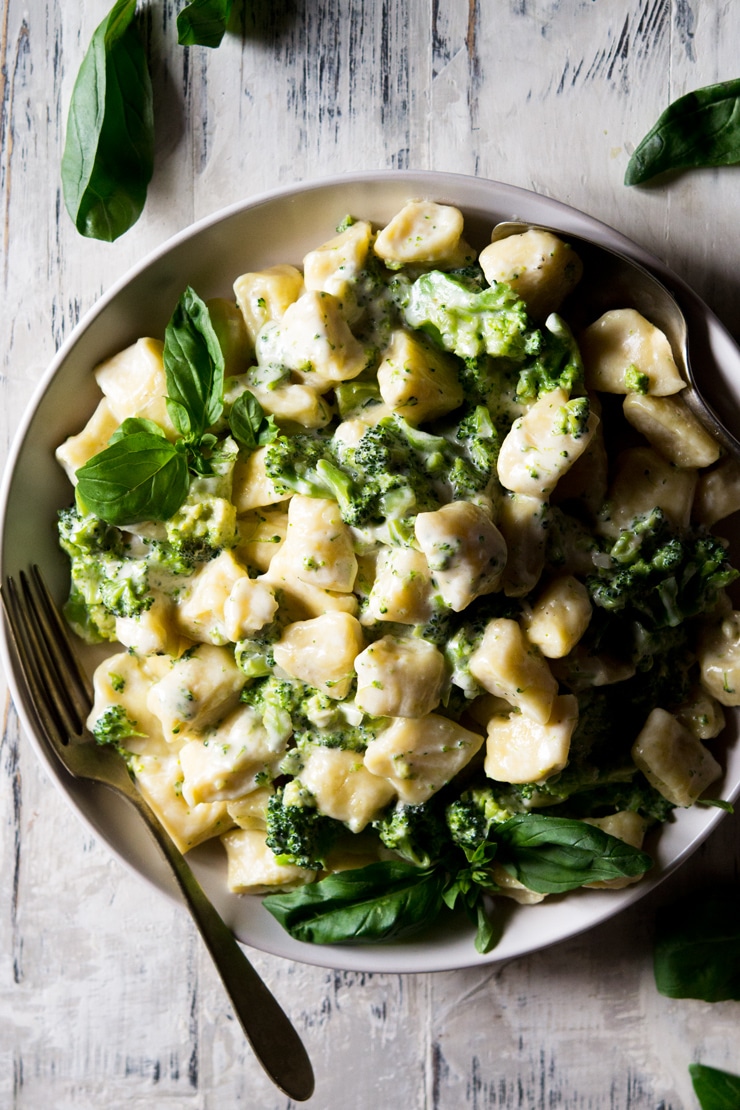easy homemade gnocchi in a large bowl with broccoli sauce on top