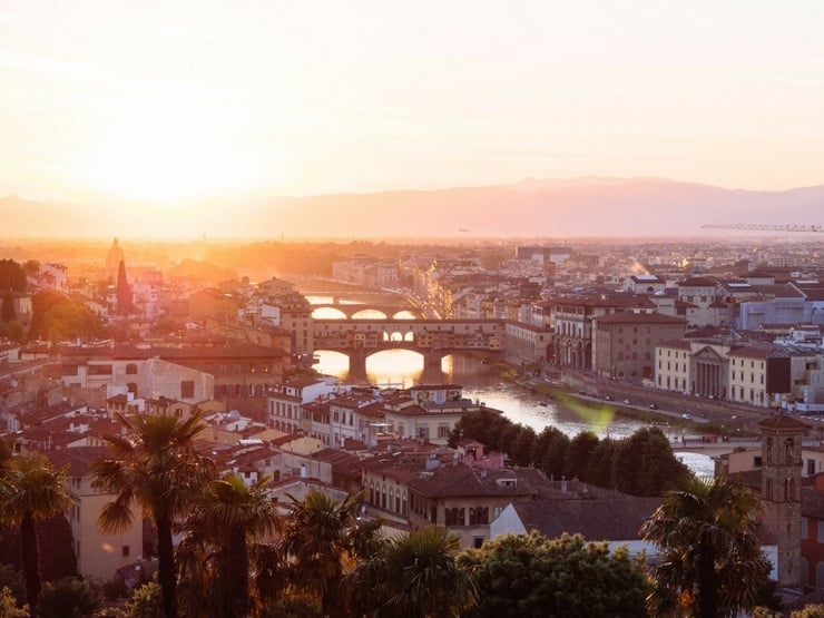 A photo of the city of Florence and the Ponte Vecchio at sunset