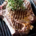 A close up of a florentine steak in a griddle pan.