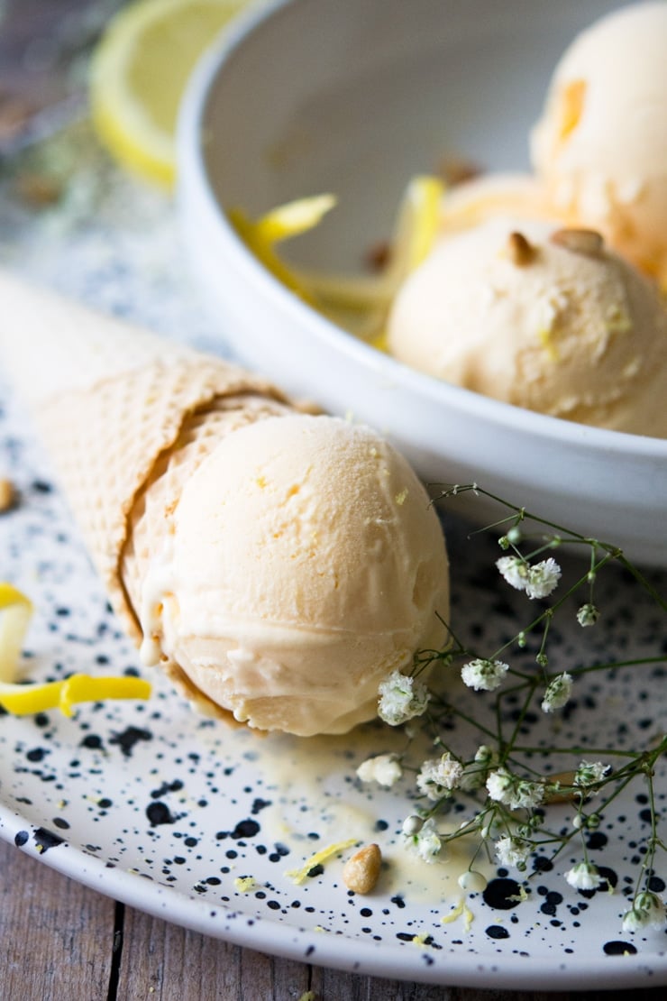 A close up of a scoop of ice cream on a cone