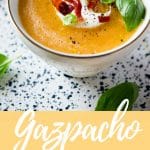 A pinterest graphic of melon gazpacho soup in a mug topped with creme fraiche