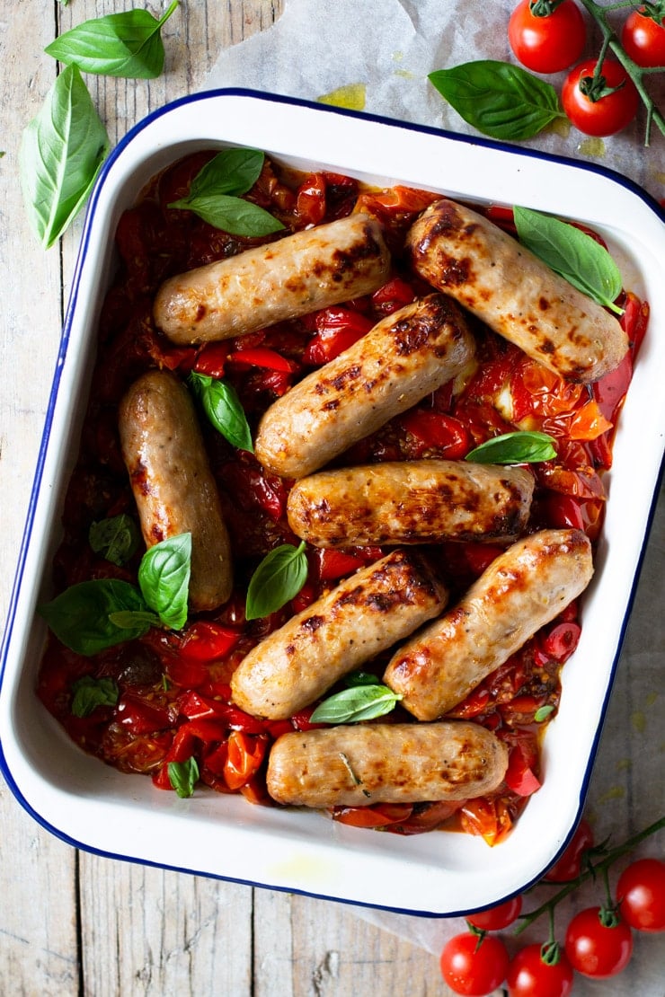 An overhead shot of a one pot Italian sausage bake with tomatoes and peppers