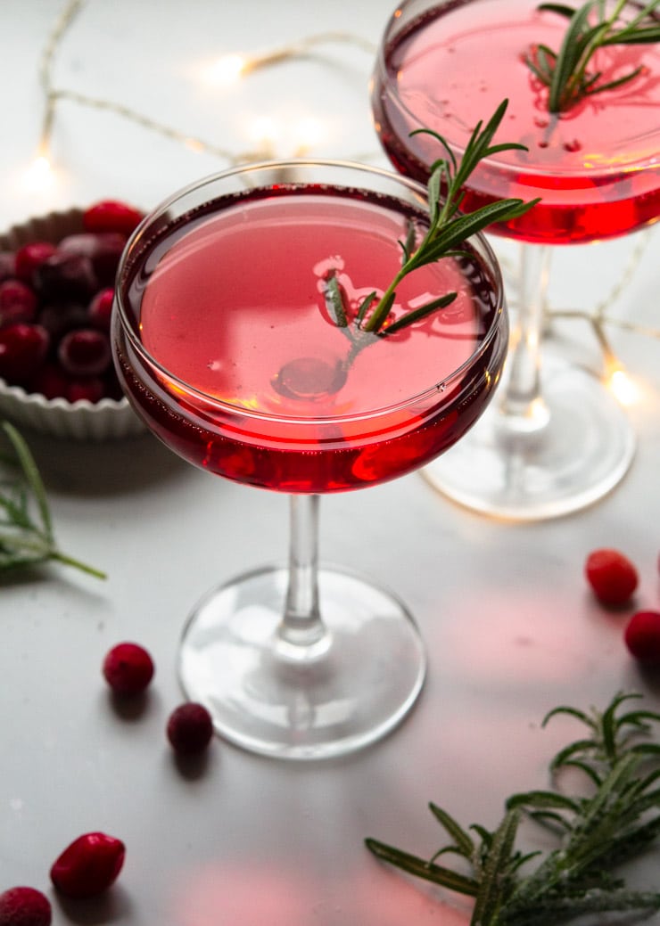 A Christmas cocktail with rosemary and cranberries